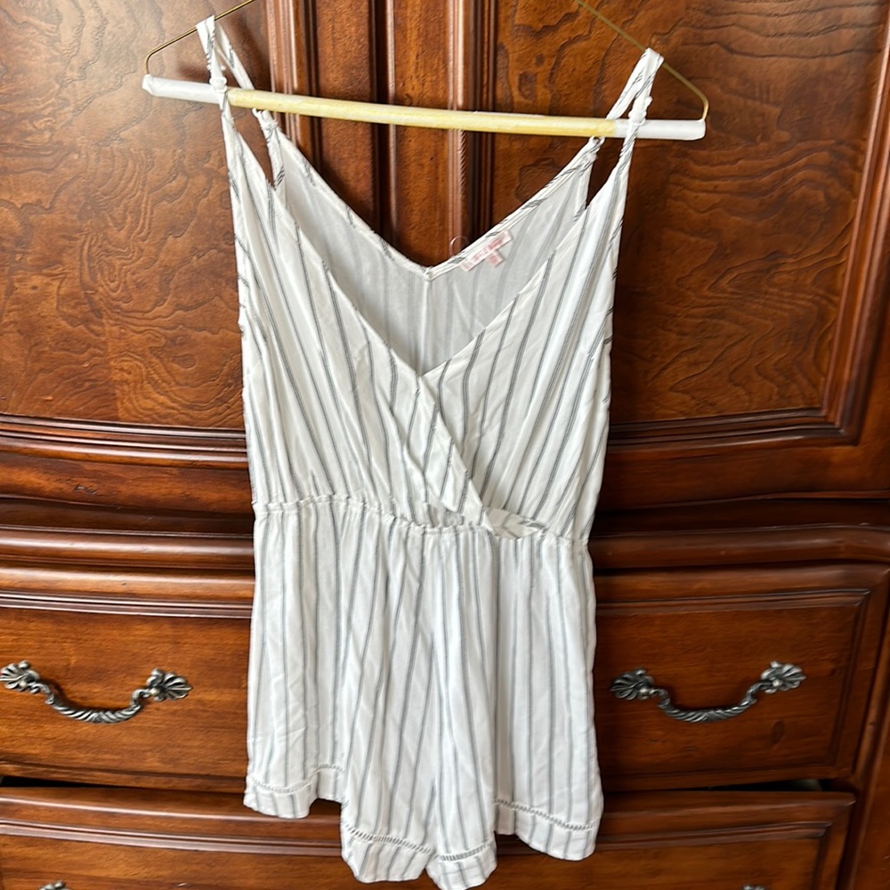 Black and white romper. Adjustable straps. Size XS. NWOT.